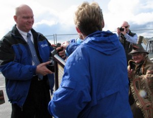 Ferry Chief Mike Neussl helps celebrate the resumption of Sitka-Angoon service at the Baranof Island city's terminal in May, 2012. (KCAW photo)