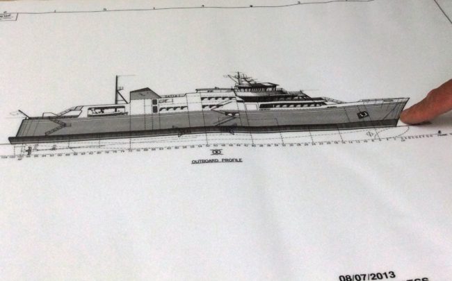 ACF Day Boat DOT Project Manager  Doug Miller points to the bow of the proposed ferry, where vehicles would load or unload. 