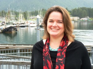 Analyst Meilani Schijvens stands by Sitka's Crescent Harbor and lightering dock. She told the Southeast Conference fishing and tourism are growing in the region. (Ed Schoenfeld/CoastAlaska News photo)