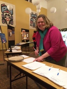 Kristen Garot organizing the silent auction.