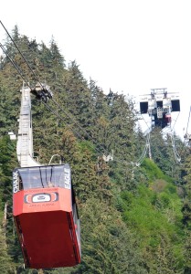 Goldbelt's Mt. Roberts Tram car Chaak (Eagle) comes down the mountain with upper terminal above. (Ed Schoenfeld, CoastAlaska News)