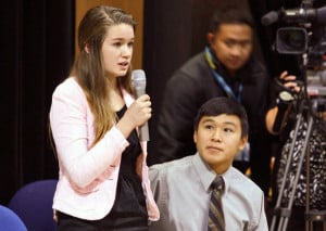 Nelson Kanuk, seated, and Katherine Dolma, standing, were two of the six young plaintiffs who sued the State of Alaska, demanding it take action on climate change. The pair are pictured here in Barrow, following a Supreme Court LIVE hearing at Barrow High School. (Photo by Jeff Seifert/ KBRW)