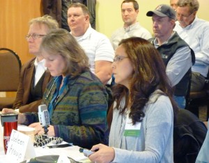 Sealaska Vice President and General Counsel Jaeleen Araujo, front right, describes Tongass land being transferred to the regional Native corporation under terms of recently-passed legislation. (Ed Schoenfeld/CoastAlaska News)