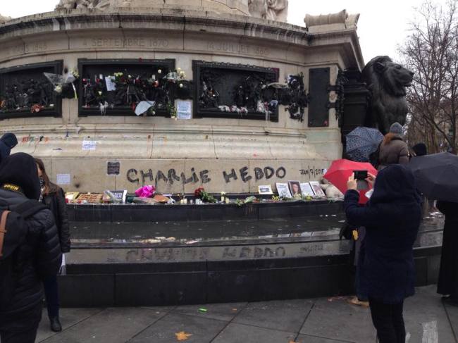 Henry DeCherney says people have been holding vigils and leaving candles, pens and flowers at the Bastille in Paris. (Photo by Henry DeCherney)