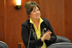 Rep. Lynn Gattis applauds after introducing a guest on the House floor, Feb 26, 2014. (Photo by Skip Gray/Gavel Alaska)