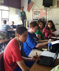 Students working on presentations at Central Middle School. From left: Edward Hazelton, Draven Maynard, Alissa Steinbich, and Kayleigh Godbee. (Photo courtesy of Aura Beatty)