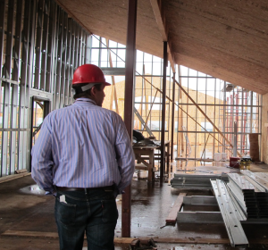 Kris Manke walks through the new Phillips Ayagnirvik Treatment Center. (Photo by Ben Matheson, KYUK)