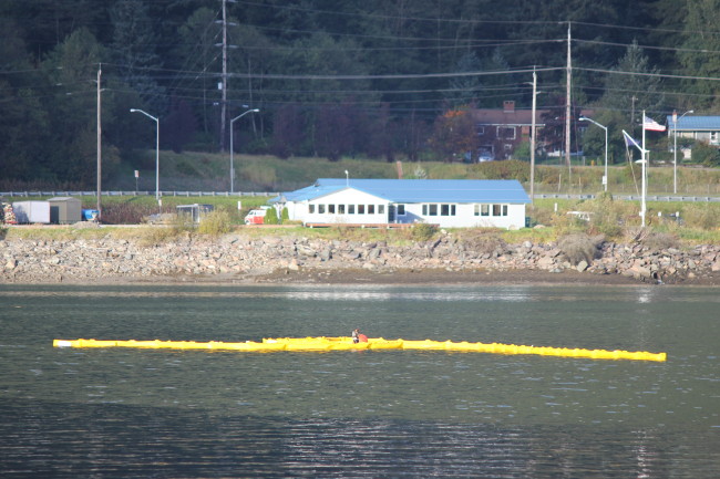 USCG containment boom is placed around the sunken tug Challenger on Sept. 13, 2015. (Photo courtesy C. Bressler/ Alaska Department of Environmental Conservation)