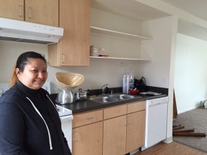 Mae Lee in her new apartment at Susitna Square. (Photo by Anne Hillman/KSKA)