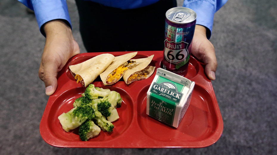 A school lunch tray featuring whole wheat tortillas at the School Nutrition Association conference in July 2014. The association is asking Congress to relax the federal school nutrition standards in hopes of attracting more kids back to the school lunch line. (Photo by Charles Krupa/AP)